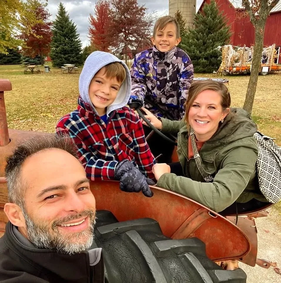 Brendan Piper with his wife Lisa and two boys at a Wisconsin farm